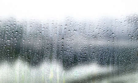 Condensation on the window. Rain drops on the glass. Rainy day.