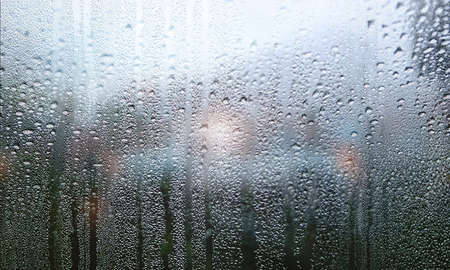 Rain drops on the window. Raindrops on the window. Rainy weather.
