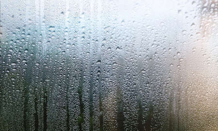 Condensation on the window. Raindrops on the window. Background