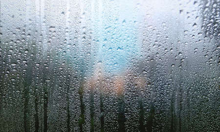 Condensation on the window. Raindrops on the window. Rainy weather.