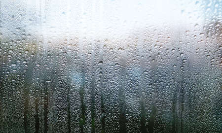 Condensation on the window. Rain drops on the glass. Raindrops on the window.