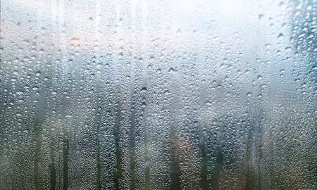 Condensation on the window. Rain drops on the glass. Rainy weather.