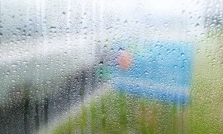Background with rain drops close up. Rain drops on outdoor window, Closeup view transparent water...
