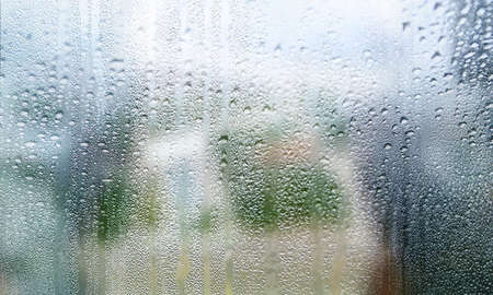 Background with rain drops close up. Rain drops on outdoor window, Closeup view transparent water...