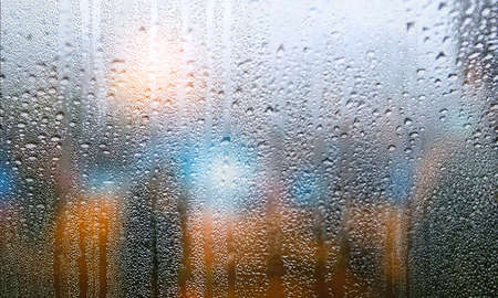 Background with rain drops close up. Rain drops on outdoor window, Closeup view transparent water...