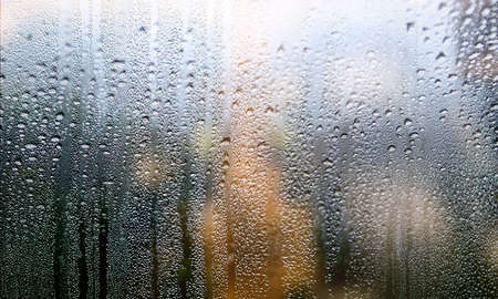 Condensation on the glass. Rain drops on the window. Natural background.