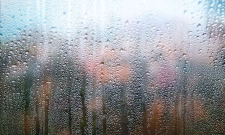 Condensation on the window. Raindrops on the window. Rainy weather.