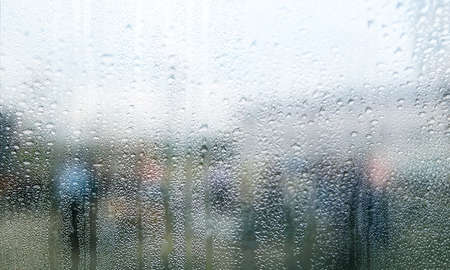 Drops of rain on the window, rainy day, blurred background