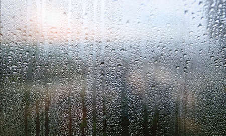 Water drops on the glass. Raindrops on the window. Rainy weather.