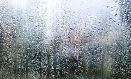 Background with rain drops close up. Rain drops on outdoor window, Closeup view transparent water...
