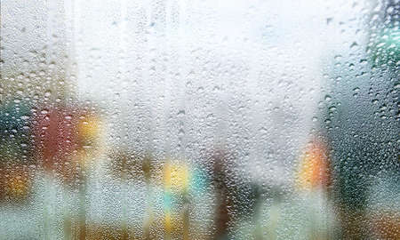 Background with rain drops close up. Rain drops on outdoor window, humid water backdrop, blurred...