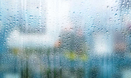 Condensation on the window. Rain drops on the glass. Rainy weather.
