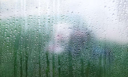 Background with rain drops close up. Rain drops on outdoor window, Closeup view transparent water...