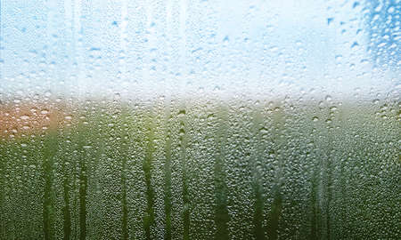 Condensation on the window. Raindrops on the glass. Natural background.