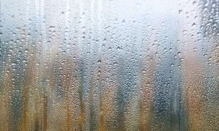 Background with rain drops close up. Rain drops on outdoor window, humid water backdrop, blurred...