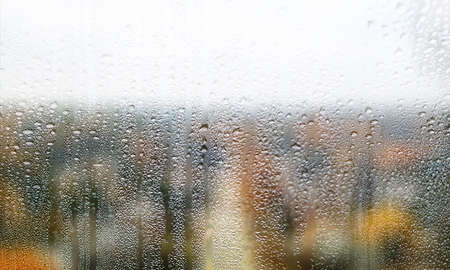 Drops of rain on the window. Rain drops on the window. Rain drops on the window. Condensation on the...