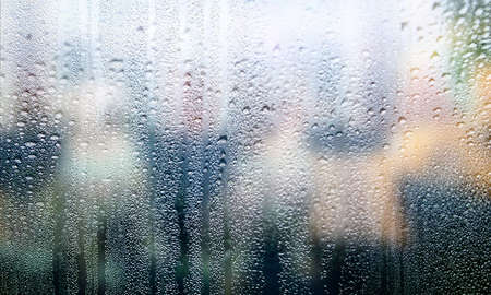 Condensation on the window. Rain drops on the glass. Natural background.