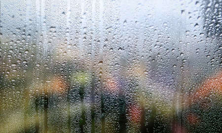 Background with rain drops close up. Rain drops on outdoor window, Closeup view transparent water...