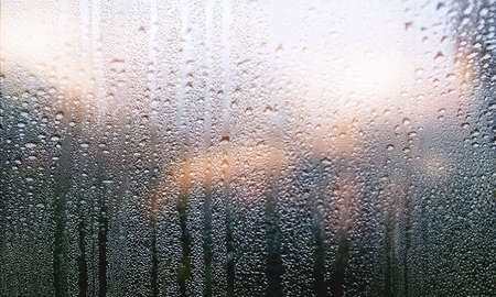 Condensation on the window, close-up. Rain drops on the window.の写真素材