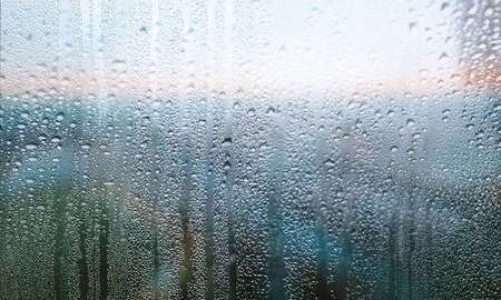 Water drops on window glass, closeup view. Rainy weatherの写真素材