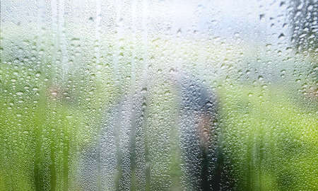 Rain drops on the window. Natural background. Rainy weather.