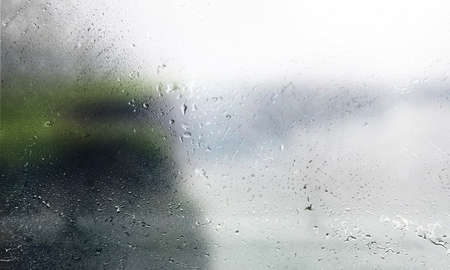Drops of rain on the window, close-up. Rainy weather.