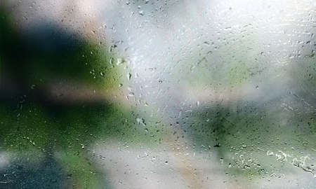 Water drops on the glass, blurred background. Rain drops on the window.