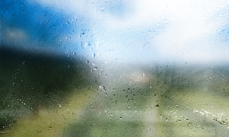Rain drops on the window, close-up. Raindrops on the glass, blurred background