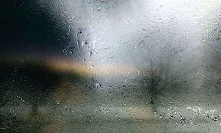 Drops of rain on the window. Raindrops on the glass. Rainy weather.