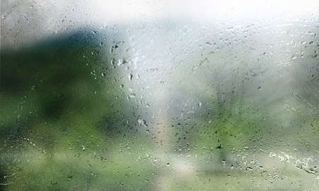 Background with rain drops close up. Rain drops on outdoor window, Closeup view transparent water...