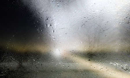 Drops of rain on the window, blurred background. Rainy weather