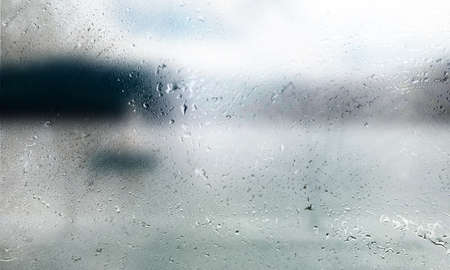 Background with rain drops close up. Rain drops on outdoor window, shallow DOF.