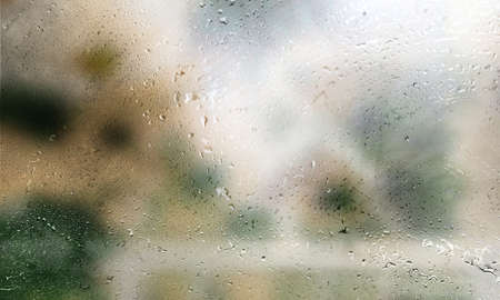 Drops of rain on the window, close-up view. Rain drops on glass, humid water backdrop, blurred...