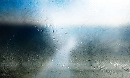 Rain drops on the window. Close-up. Blurred background.