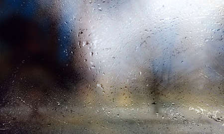 Rain drops on the window, blurred background. Rainy day.