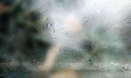 Background with rain drops close up. Rain drops on outdoor window, Closeup view transparent water...