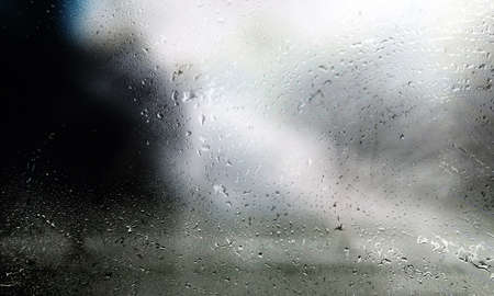 Condensation on the window. Water drops on the glass. Rainy weather.