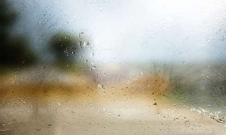 Water drops on the window. Raindrops on the glass, blurred background