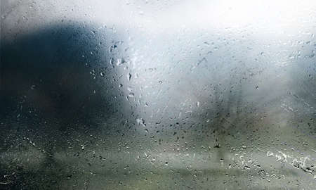 Water drops on the glass. Raindrops on the window. Abstract background.