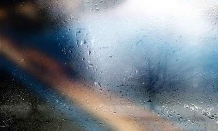 Water drops on the window with blurred background. Rainy weather.