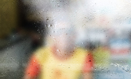 Blurred background with rain drops on glass surface, shallow DOF