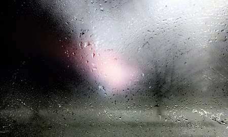 Drops of rain on the window, blurred background. Rain drops on the window.