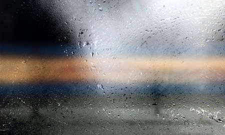 Drops of rain on the window, blurred background. Rainy weatherの写真素材