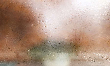 Drops of rain on the window, close-up. Rain drops on the glass, blurred background