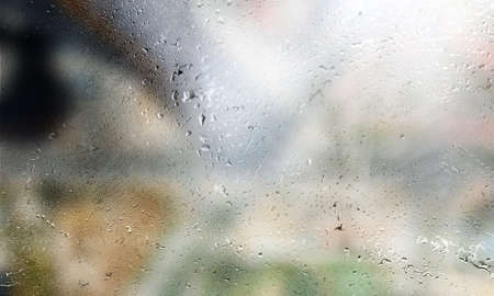 Background with rain drops close up. Rain drops on outdoor window, Closeup view transparent water...