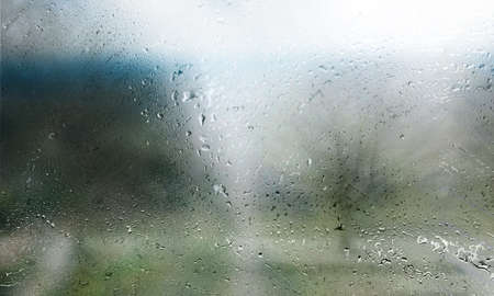 Rain drops on the window, blurred background. Rainy weather.