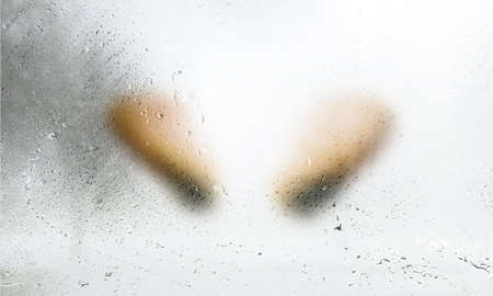 Heart shape on the condensation on the window. Abstract background.