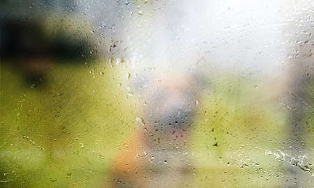 Background with rain drops close up. Rain drops on outdoor window, Closeup view transparent water...