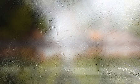 rain drops on the window, rainy day in the city, abstract background