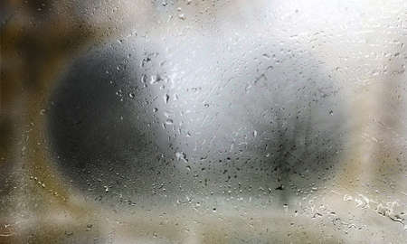 Drops of rain on the window. Rain drops on the glass. Abstract background.